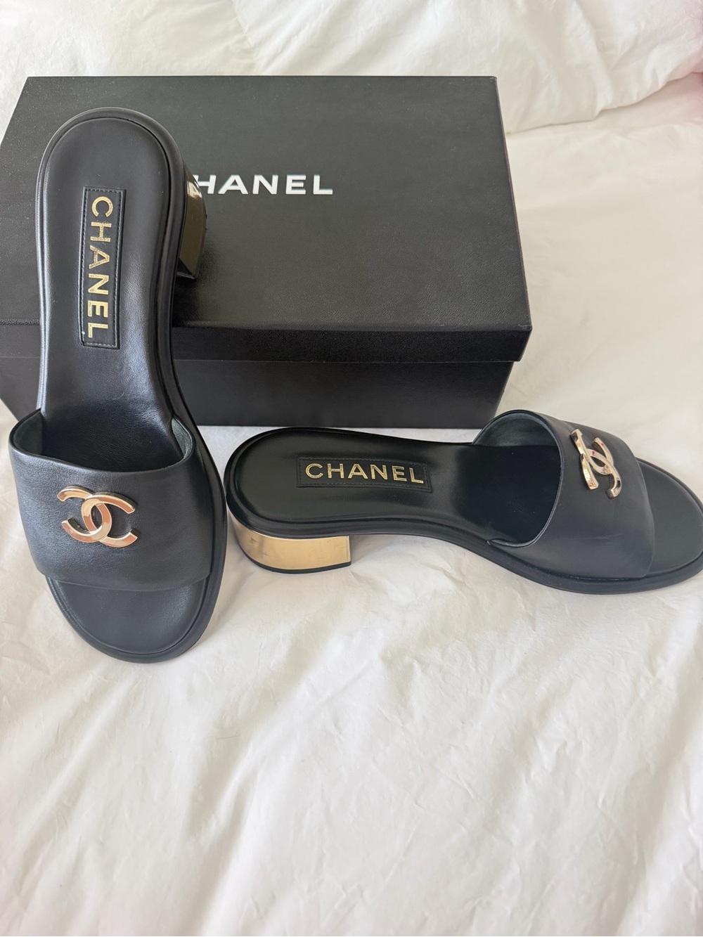 CHANEL 23K Black Leather Slide Mules with Gold CC Hardware